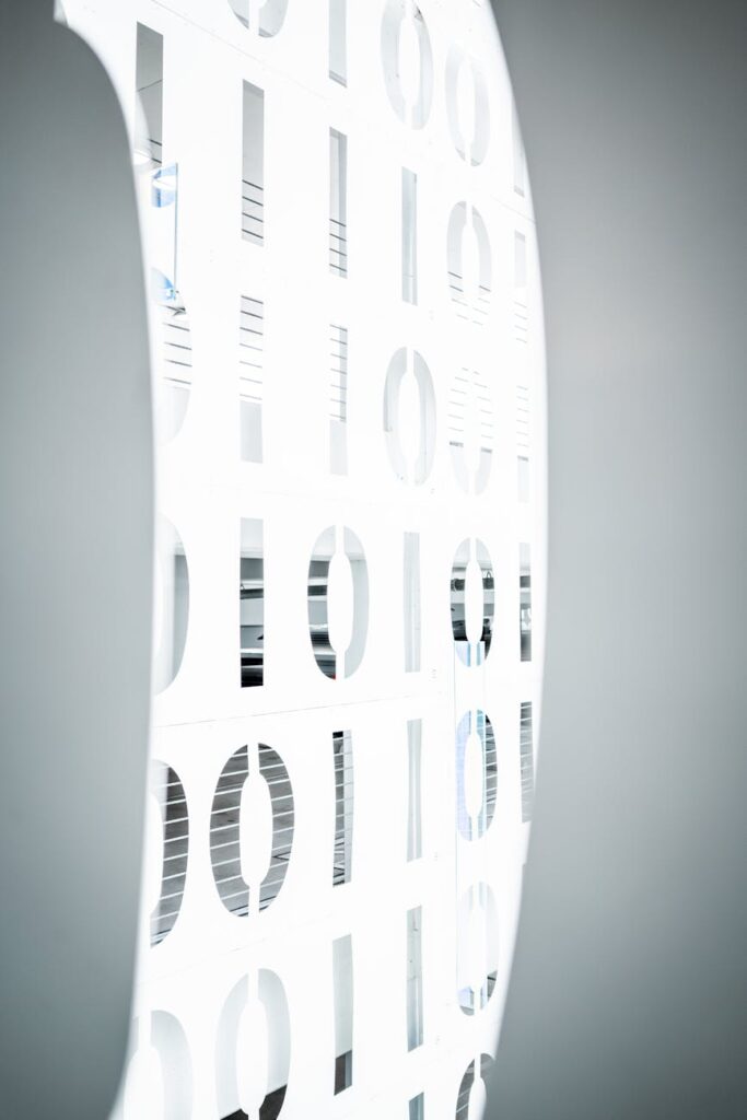 An abstract image of an hourglass representing time-locked tokens with a blockchain-themed background.