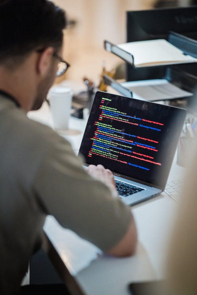 Close-up of a computer monitor displaying lines of code, symbolizing smart contract development.