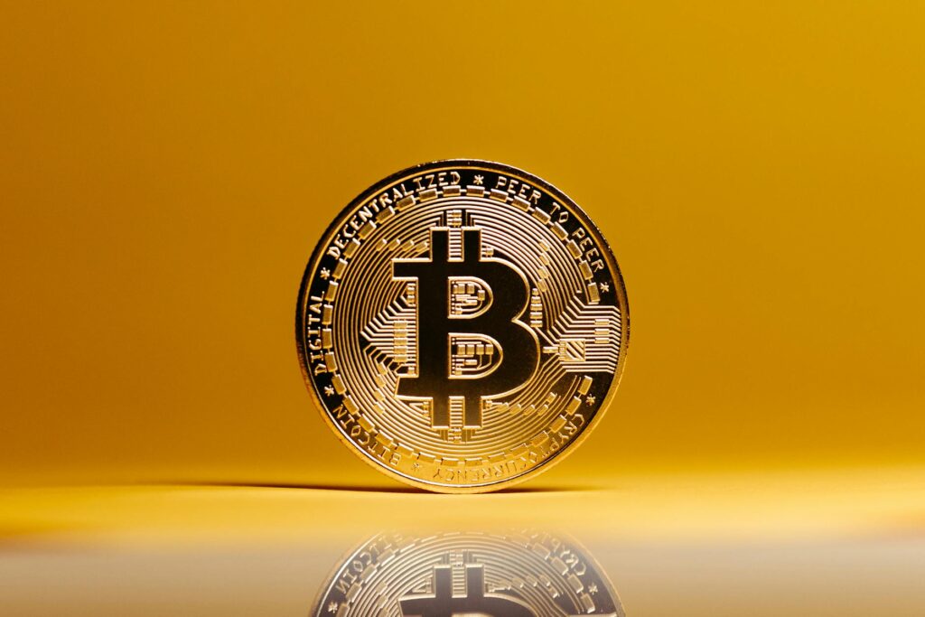 A close-up of a golden cryptocurrency coin with digital network lines emanating from it, symbolizing value transfer.