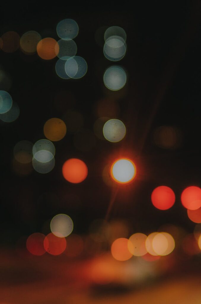 A single gold bar placed beside a reflective black surface with a single drop of crude oil, symbolizing the digital gold vs digital oil analogy.