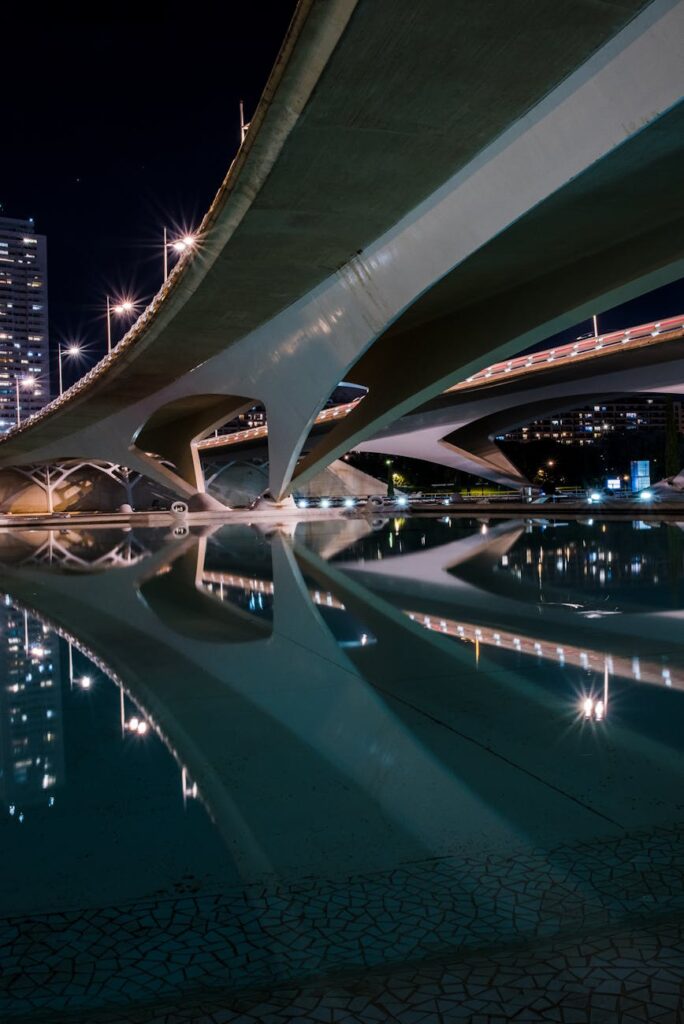 A vibrant cityscape at night with glowing lines connecting buildings, symbolizing the infrastructure connecting app-chains.