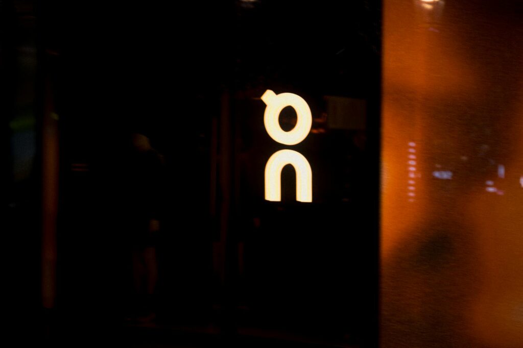 A person's hand interacting with a holographic user interface displaying secure transaction data.