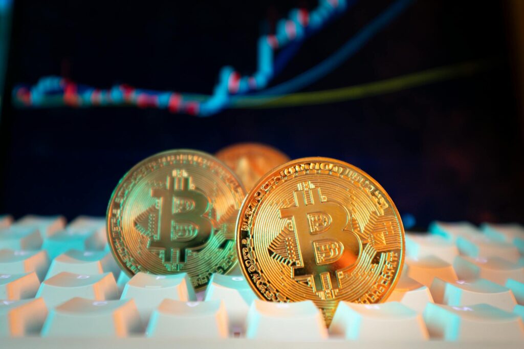A close-up of a financial chart on a screen showing cryptocurrency price fluctuations and investment data.