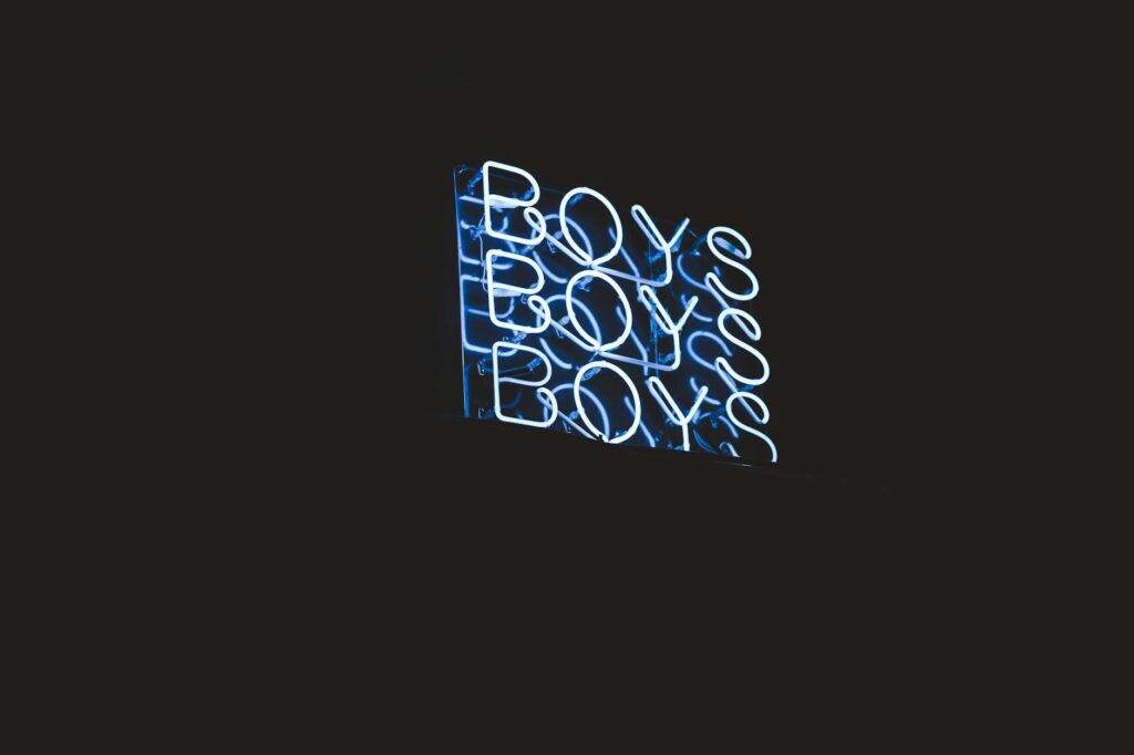 A vibrant, glowing neon Bitcoin symbol against a dark, futuristic background representing digital currency.