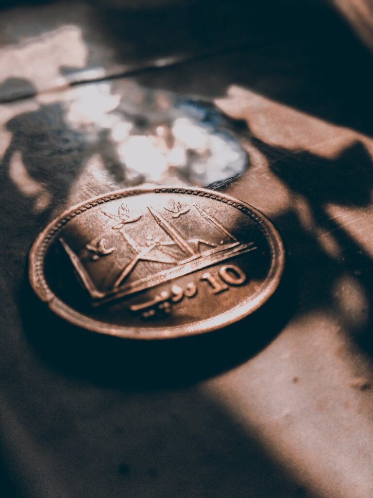 Macro shot of a physical Ethereum coin showcasing its intricate design.