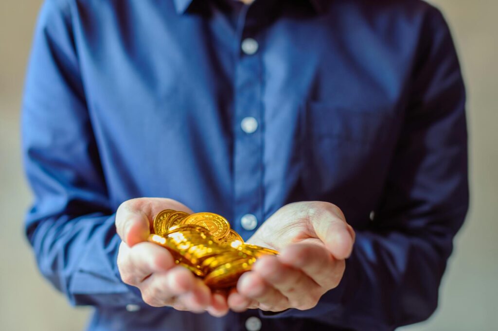 A close-up of a person's hands holding a smartphone displaying a secure cryptocurrency wallet app interface.