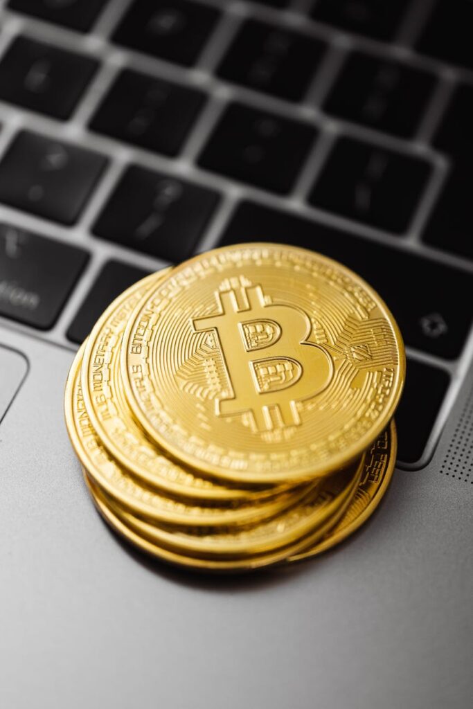 A sleek, black hardware wallet connected to a computer, emphasizing the importance of secure crypto self-custody.