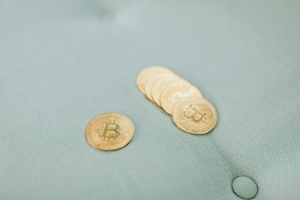 A close-up shot of physical bitcoin coins stacked neatly, symbolizing digital wealth.