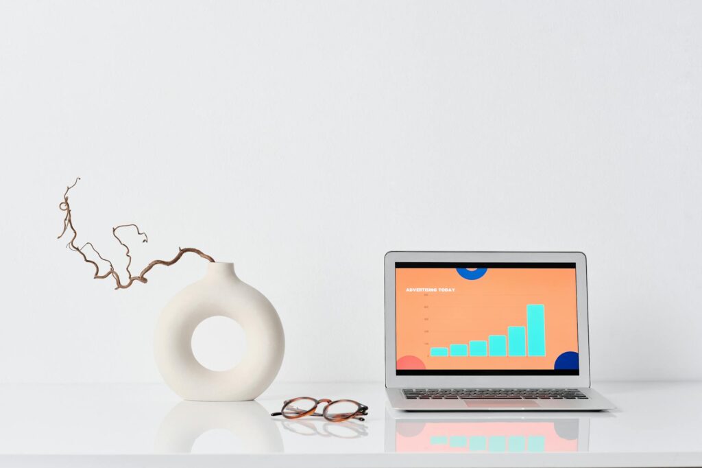 Close-up of a digital screen showing a red, bearish candlestick chart for a cryptocurrency, indicating a price drop.