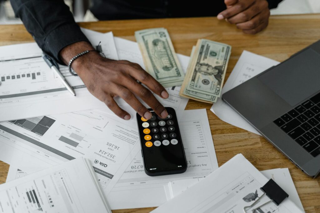 A person's hands on a laptop keyboard showing a cryptocurrency portfolio, with a digital padlock icon signifying security.