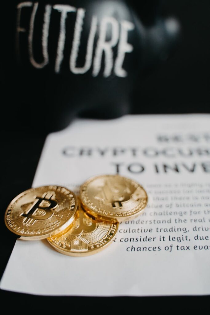 A close-up shot of a physical gold coin and a physical Bitcoin token side-by-side, symbolizing the merging of physical and digital value.
