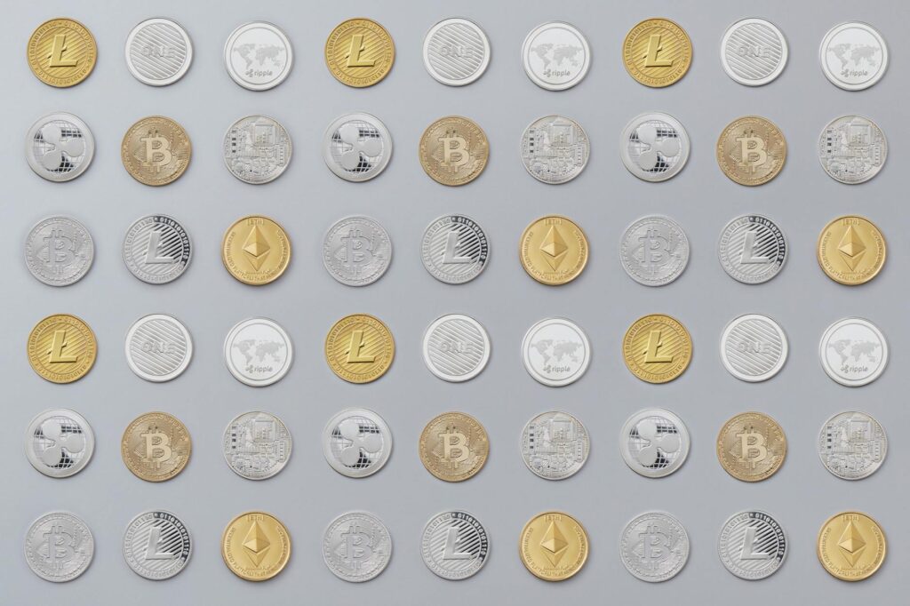 A close-up shot of physical Bitcoin and Ethereum coins resting on a textured, dark surface.