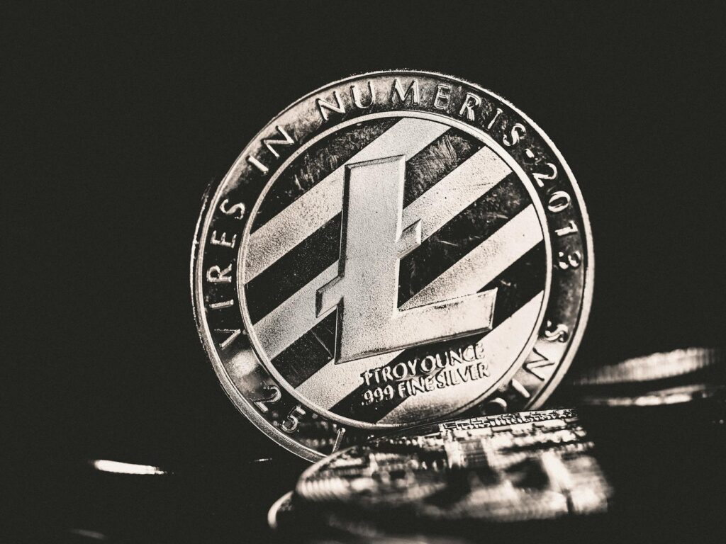 A close-up shot of a physical gold Bitcoin coin, symbolizing digital wealth.