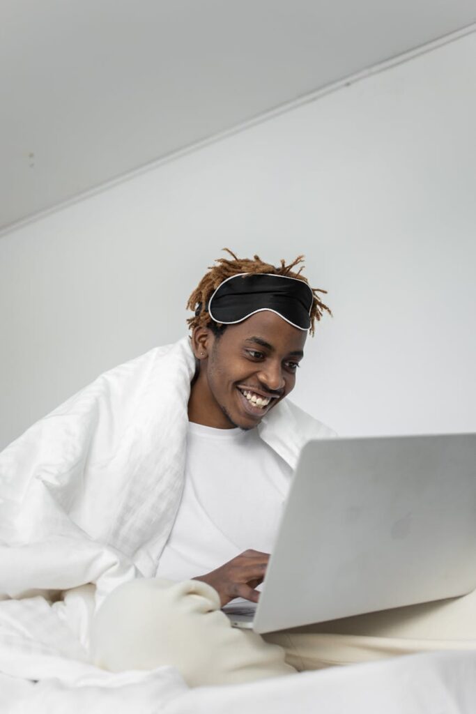A newcomer to crypto studying a complex price chart of different digital currencies on a modern laptop screen.