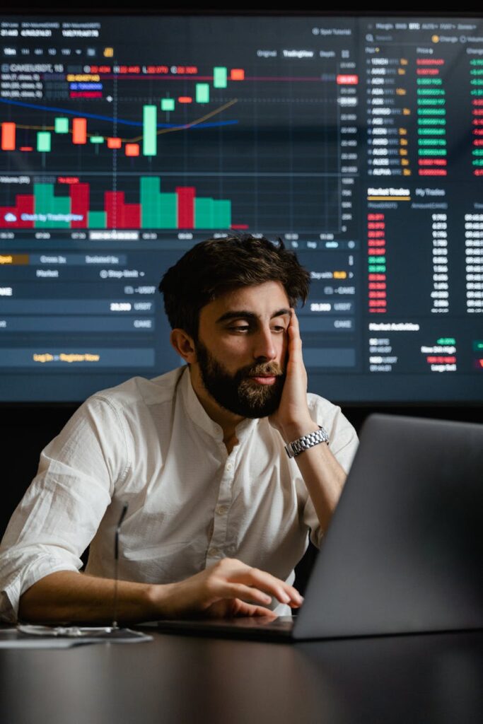 A detailed view of a computer monitor displaying intricate cryptocurrency trading charts and market data.