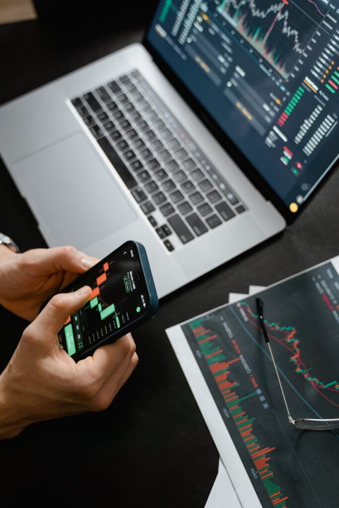 A beginner investor analyzing the price chart of Bitcoin vs Ethereum on their computer.
