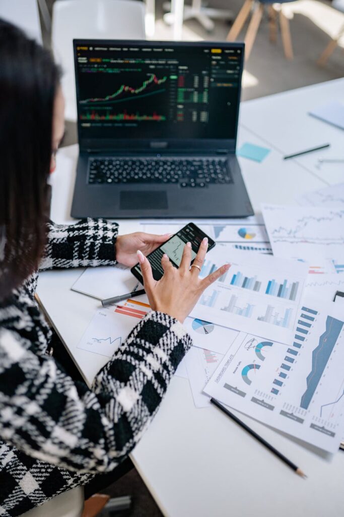 A team of financial experts discussing digital asset trends on a large screen.