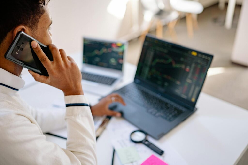 A compliance officer scrutinizing cryptocurrency transaction data on multiple monitors.