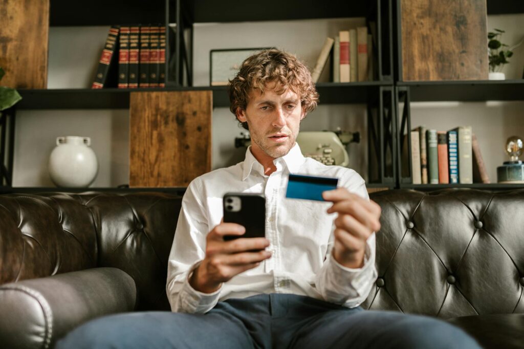 A close-up of a person's hands holding a smartphone displaying a cryptocurrency wallet interface.