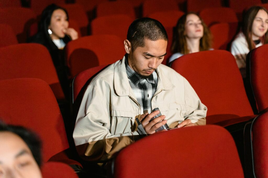 An investor looking with a puzzled expression at a complex cryptocurrency trading chart on their laptop.