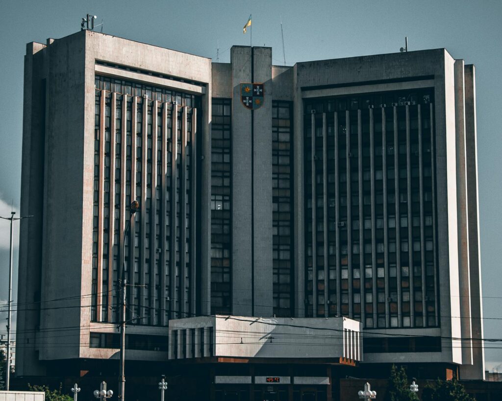 A classical government building, like a central bank, with a semi-transparent Bitcoin logo superimposed, symbolizing the clash between traditional finance and cryptocurrency.