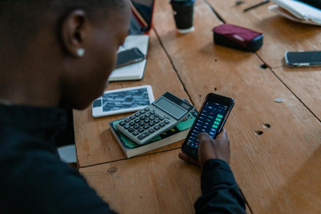 A close-up of a person's hand holding a smartphone displaying a secure cryptocurrency wallet interface.