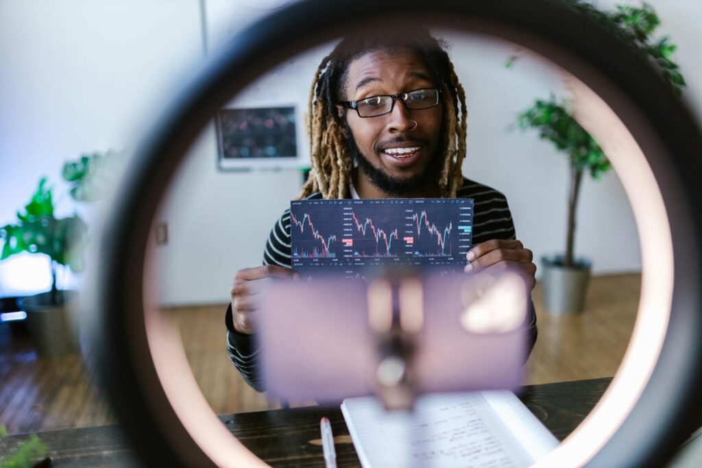 A focused trader analyzing complex cryptocurrency price charts on a multi-screen computer setup.