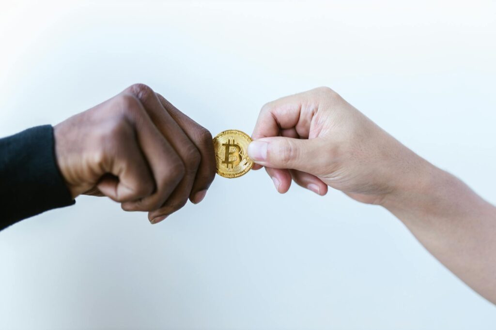 A close-up, artistic shot of a physical Bitcoin coin with a glowing digital circuit pattern overlay.