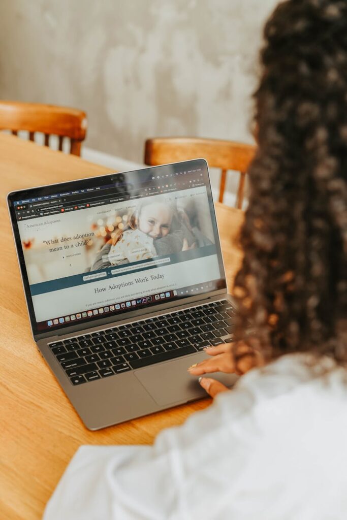 An investor analyzing cryptocurrency market data and charts on a modern laptop.