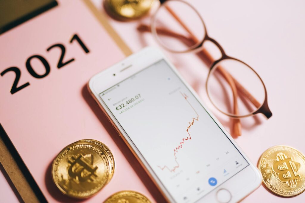 A detailed shot of physical Bitcoin and Ethereum coins resting on a textured black surface, symbolizing market value.