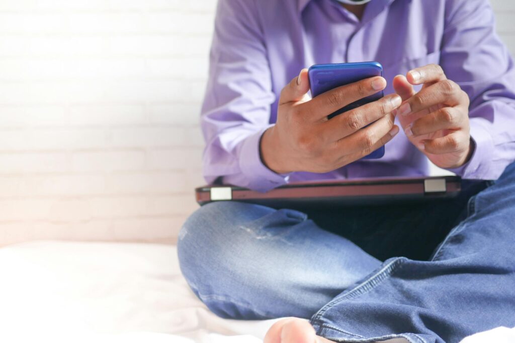 Close-up of a person's hand holding a smartphone displaying the user interface for China's digital yuan (e-CNY) wallet.
