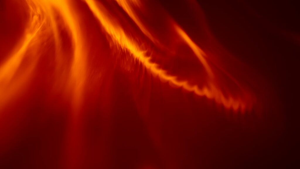 A trader looking concerned while viewing volatile cryptocurrency price charts on a laptop.