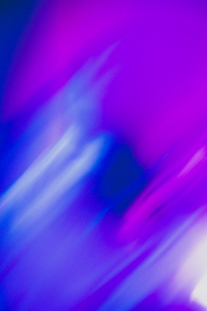 An investor analyzing cryptocurrency price charts on a laptop in a modern office.