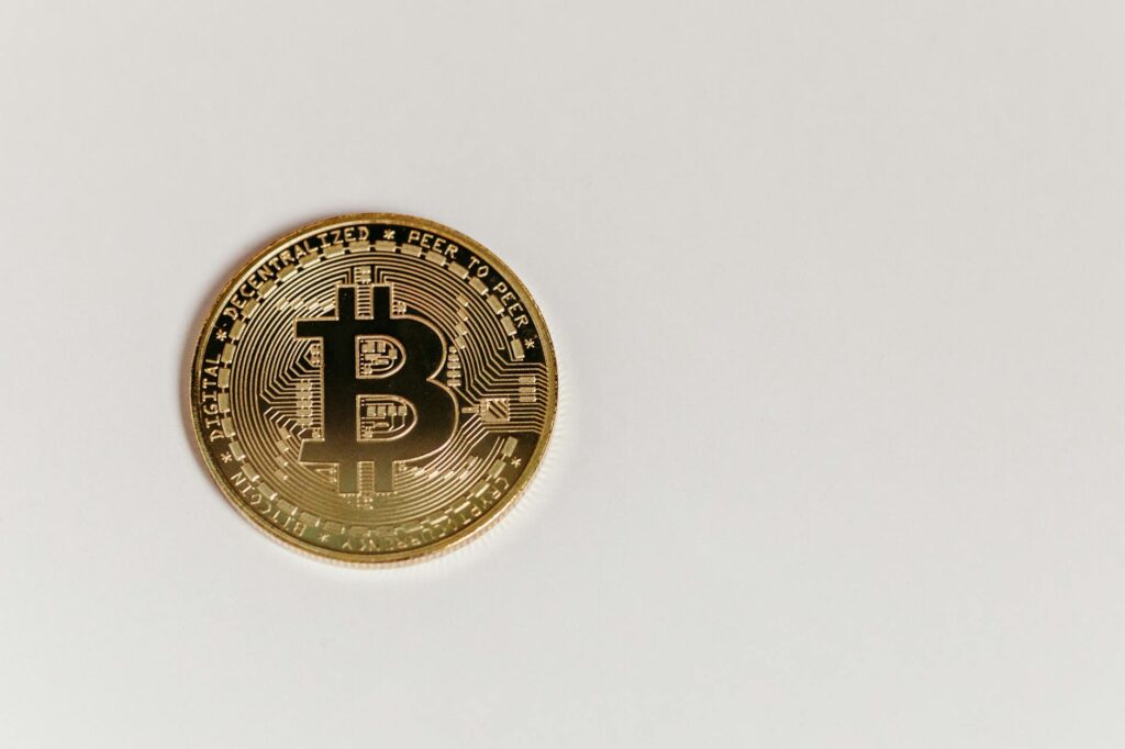 A focused analyst looking at multiple monitors displaying financial charts and cryptocurrency data.