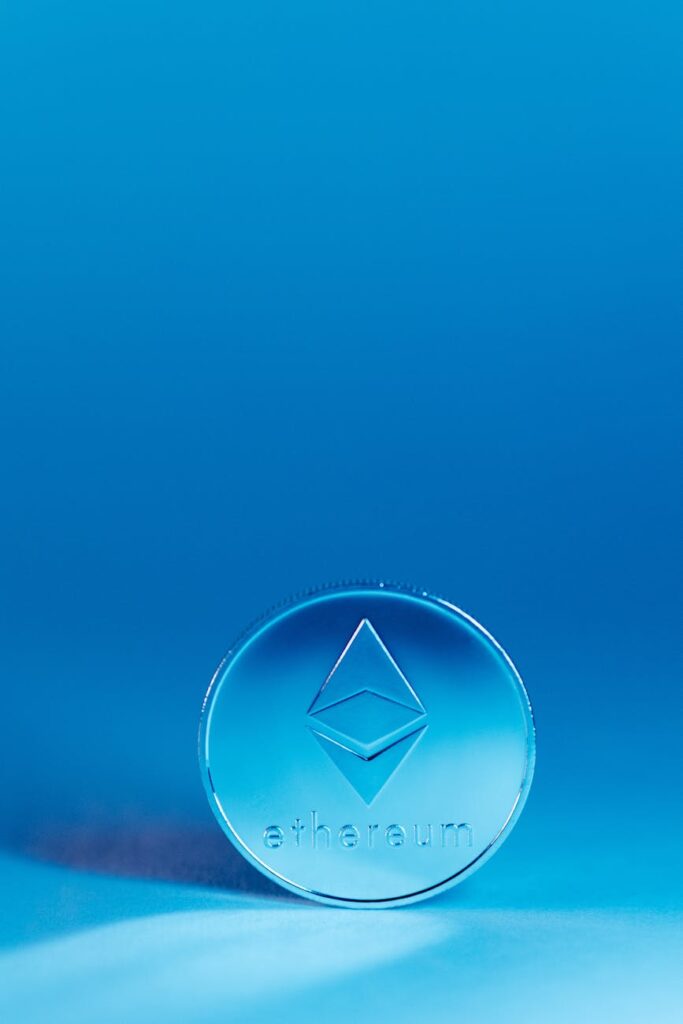 A close-up of a physical Ethereum coin, representing the value at stake during the DAO hack.