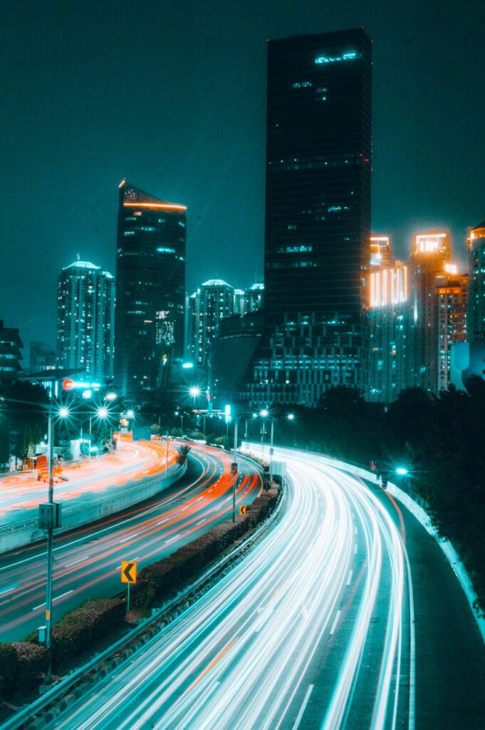 A futuristic cityscape at night with holographic cryptocurrency symbols like Bitcoin and Ethereum floating in the air.