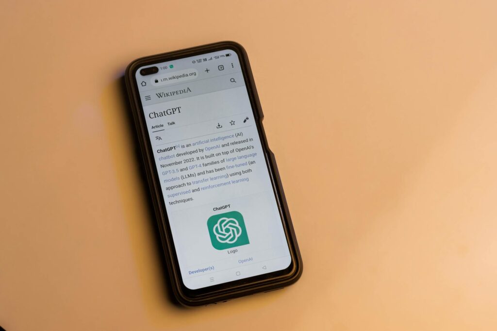 A futuristic illustration showing a smartphone protected by a digital shield connected to a secure blockchain.