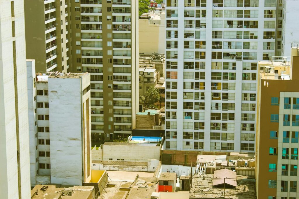 A macro shot of a physical gold Bitcoin coin standing on a dark surface, reflecting light.