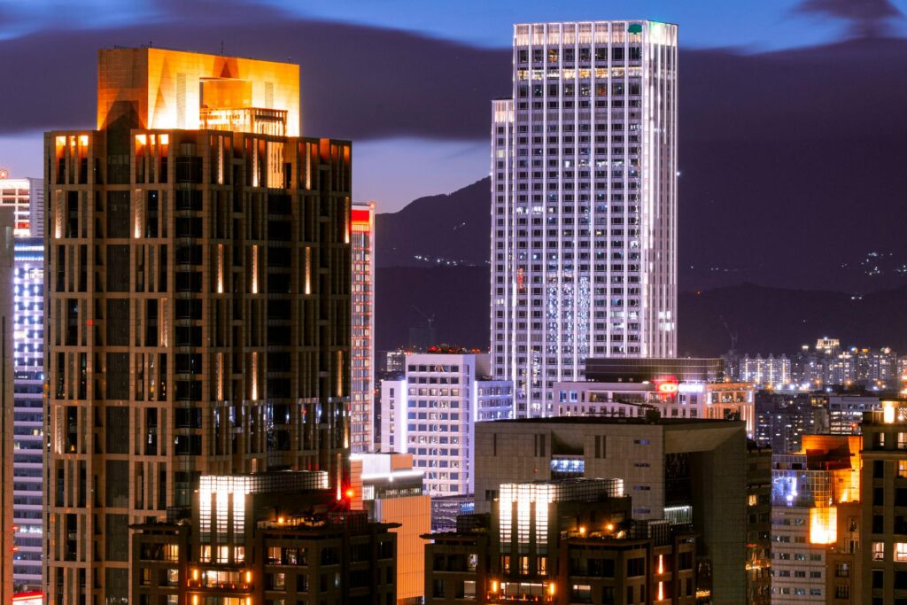 A crypto investor carefully analyzing a complex candlestick chart on a computer monitor.