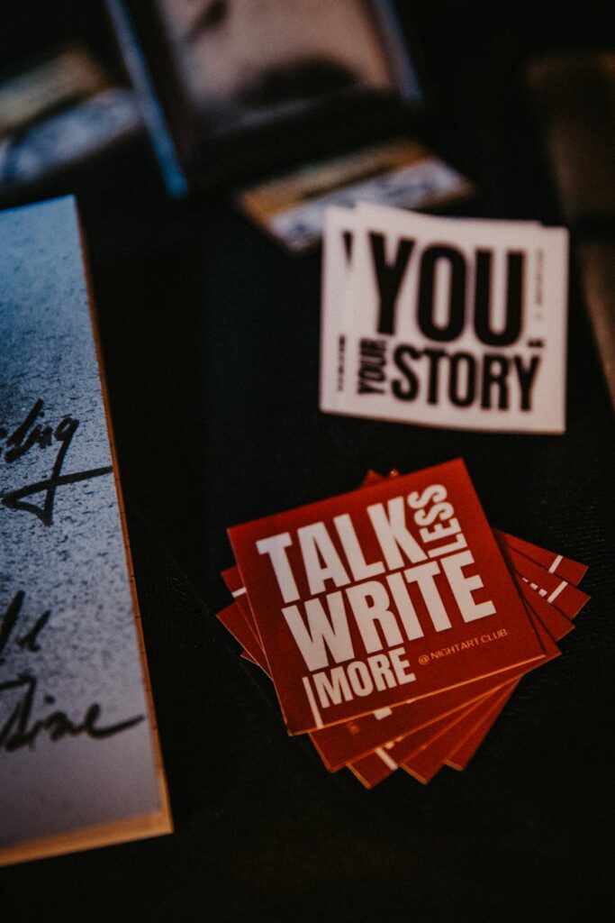 Close-up of a person carefully writing a 24-word cryptocurrency seed phrase onto a paper backup card.