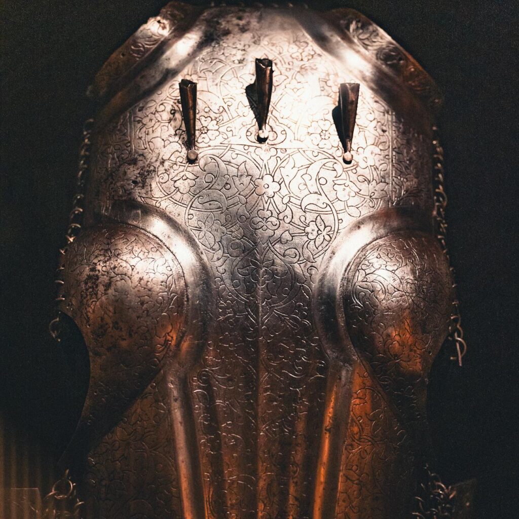 A metal plate engraved with a 24-word recovery seed phrase for a self-custodial wallet.