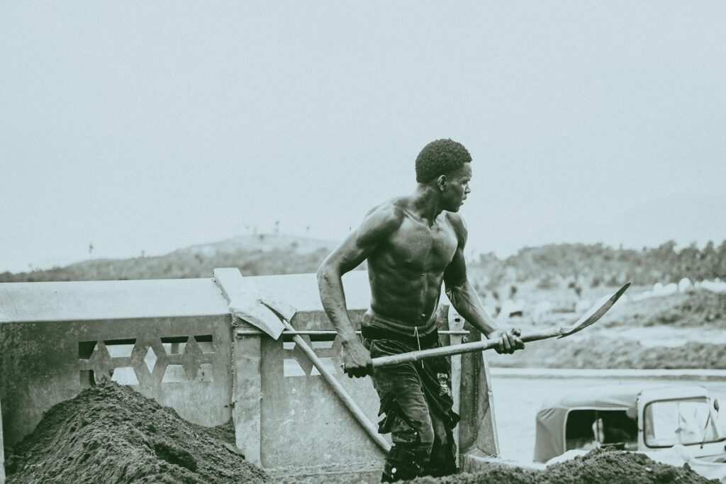 A focused investor pointing at a complex cryptocurrency candlestick chart on a brightly lit monitor in a modern office.