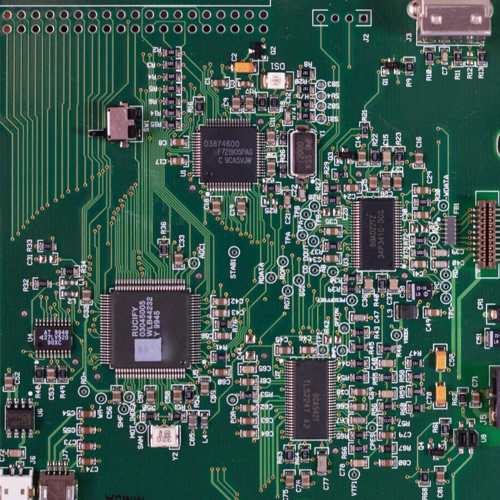 A close-up of a physical Ethereum coin glowing on a computer motherboard, representing staking value.