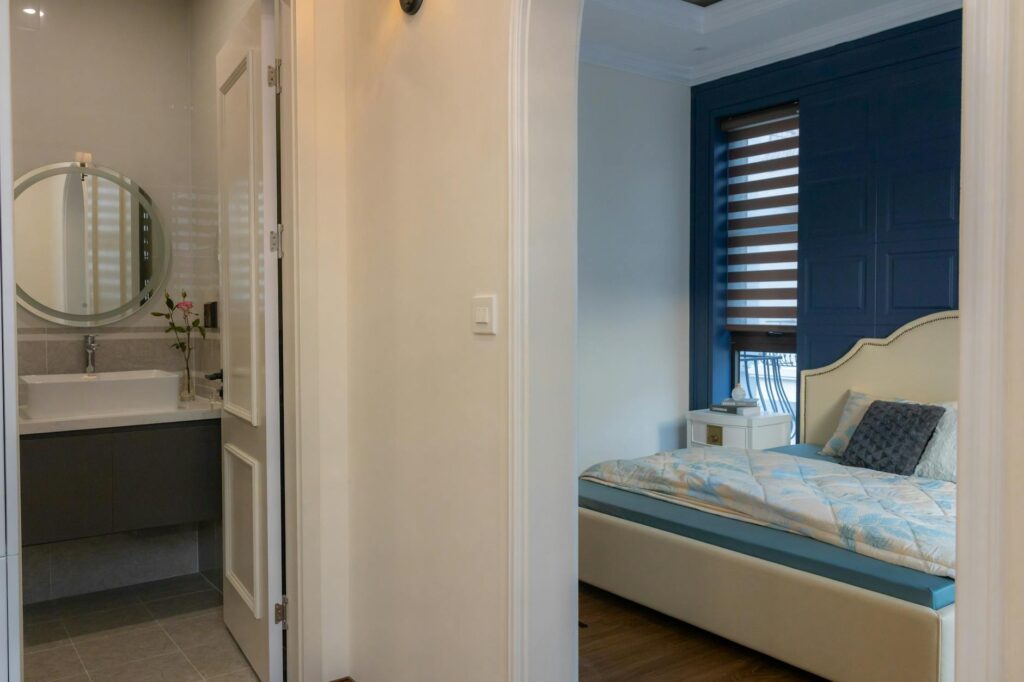 A modern data center server room with racks of hardware illuminated by cool blue lights.