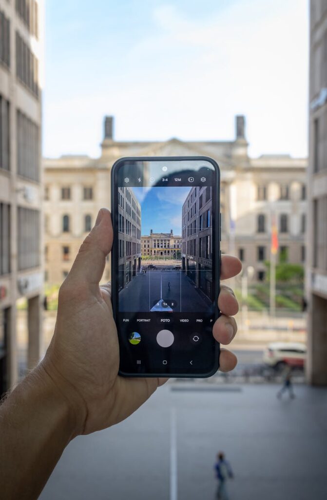 A close-up of a person holding a smartphone displaying a secure digital identity confirmation screen.
