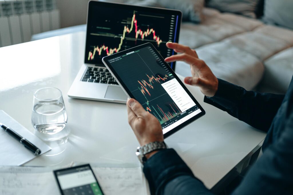 An investor carefully studies complex crypto charts, weighing the risks and rewards of advanced strategies like restaking.
