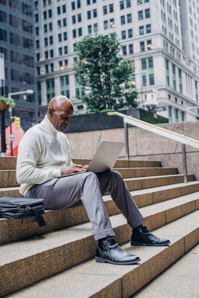 A financial analyst pointing at a complex graph on a monitor, deep in data analysis.