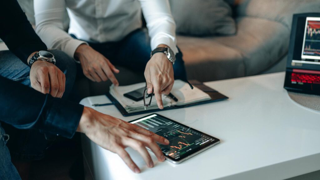 An analyst focused on multiple computer monitors showing real-time cryptocurrency trading data and on-chain analytics.