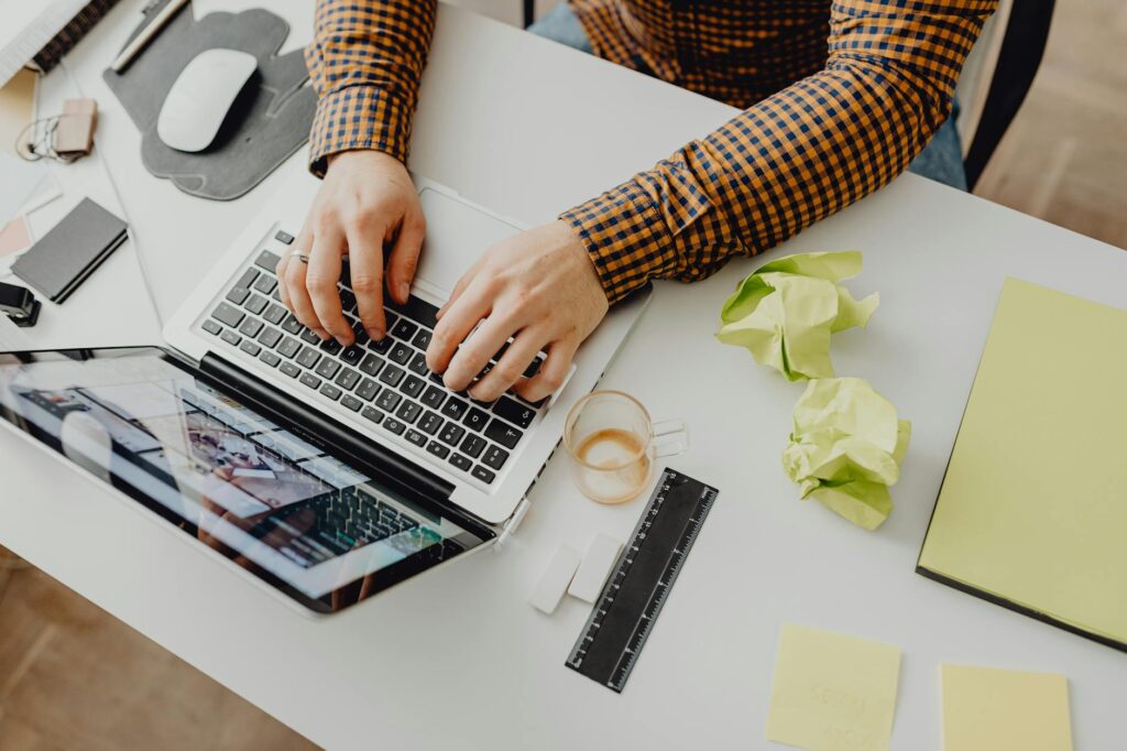 A user looking stressed in front of a computer screen showing high transaction fees, illustrating the blockchain scalability problem.