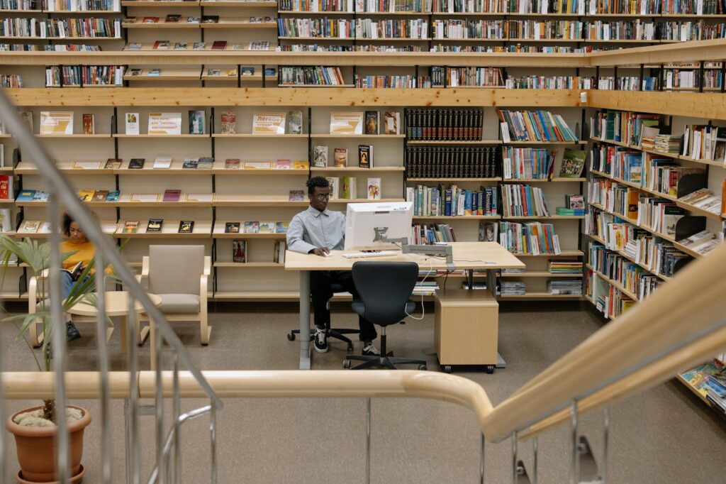 A diverse group of law students collaborating on a project in a bright, modern university library.